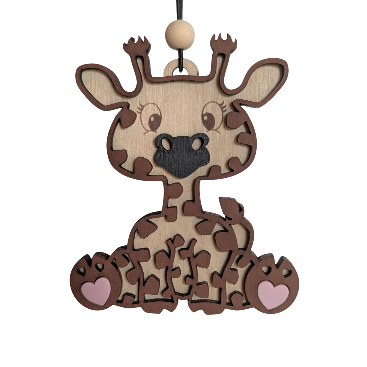Wooden giraffe ornament with a hanging loop on a white background